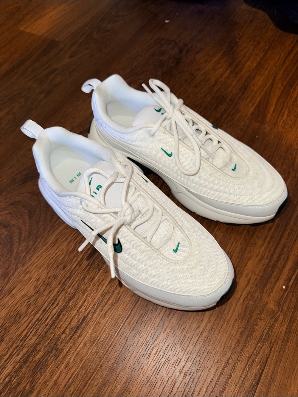 Nike White Sneakers with Green Swoosh Accents